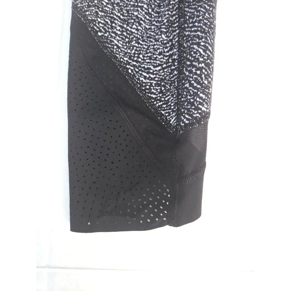 Lululemon • Wunder‎ Under Laser Cut Studio Crop Leggings • Size 8 • Black/White